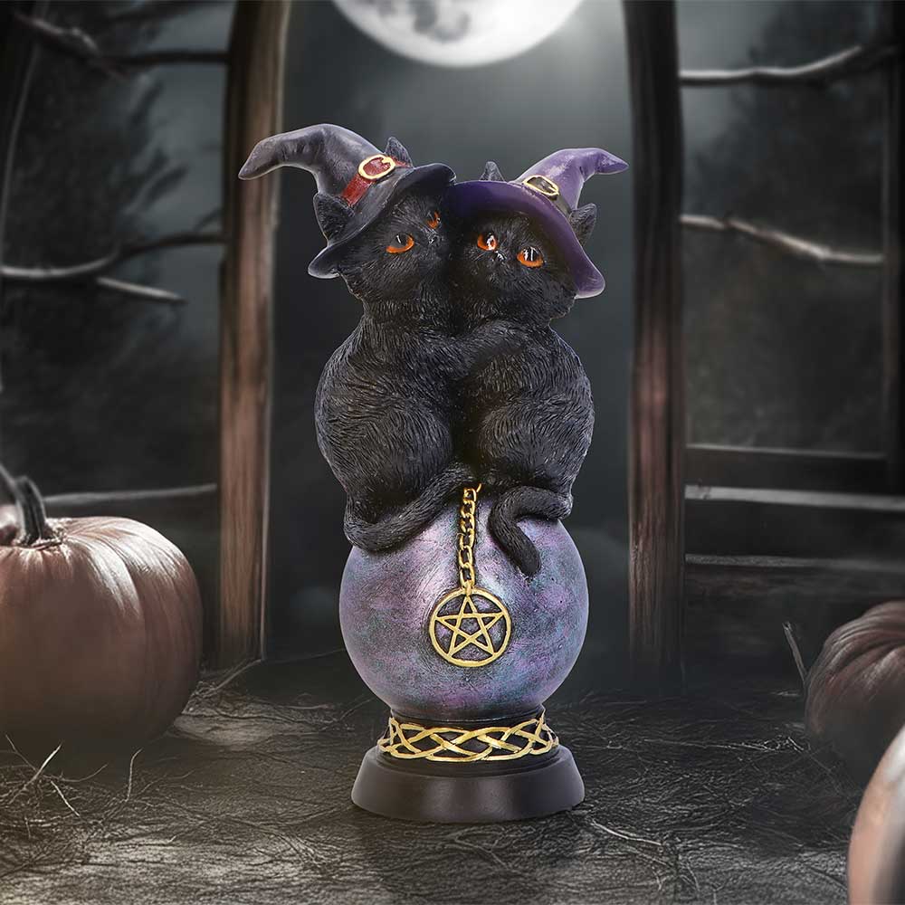 Kittens Orbuculum figurine with two black kittens wearing witch hats, perched on a purple crystal ball with a gold pentagram charm.