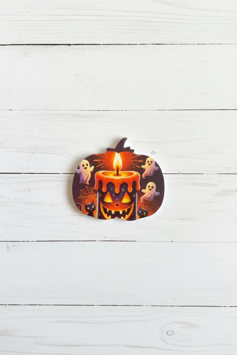 Halloween silicone focal bead in pumpkin shape with spooky face and stitch detail for pen making and crafts