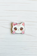 Cute acrylic kawaii cat bead with bow, heart eyes, and pink paws, for jewellery making and craft projects