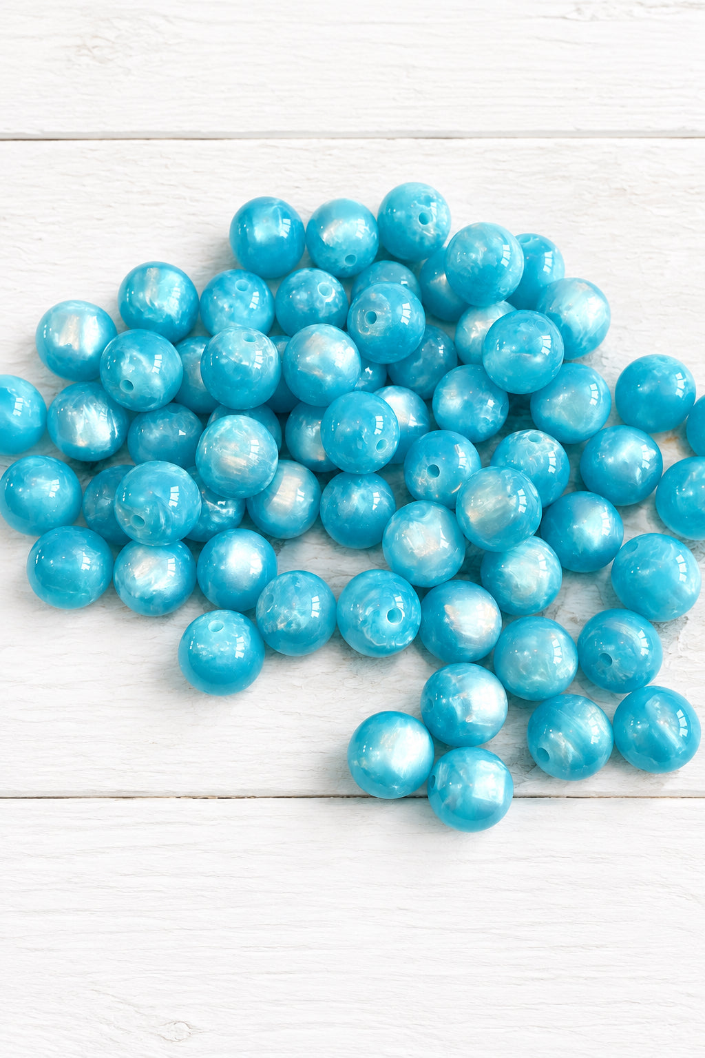 Pack of 5 pearlescent cat eye beads, 16 mm.