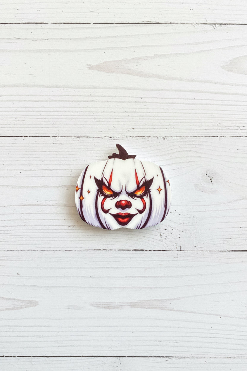 Halloween silicone focal bead in pumpkin shape with spooky face and stitch detail for pen making and crafts