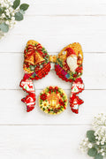 Traditional acrylic Christmas bow set with a festive design.