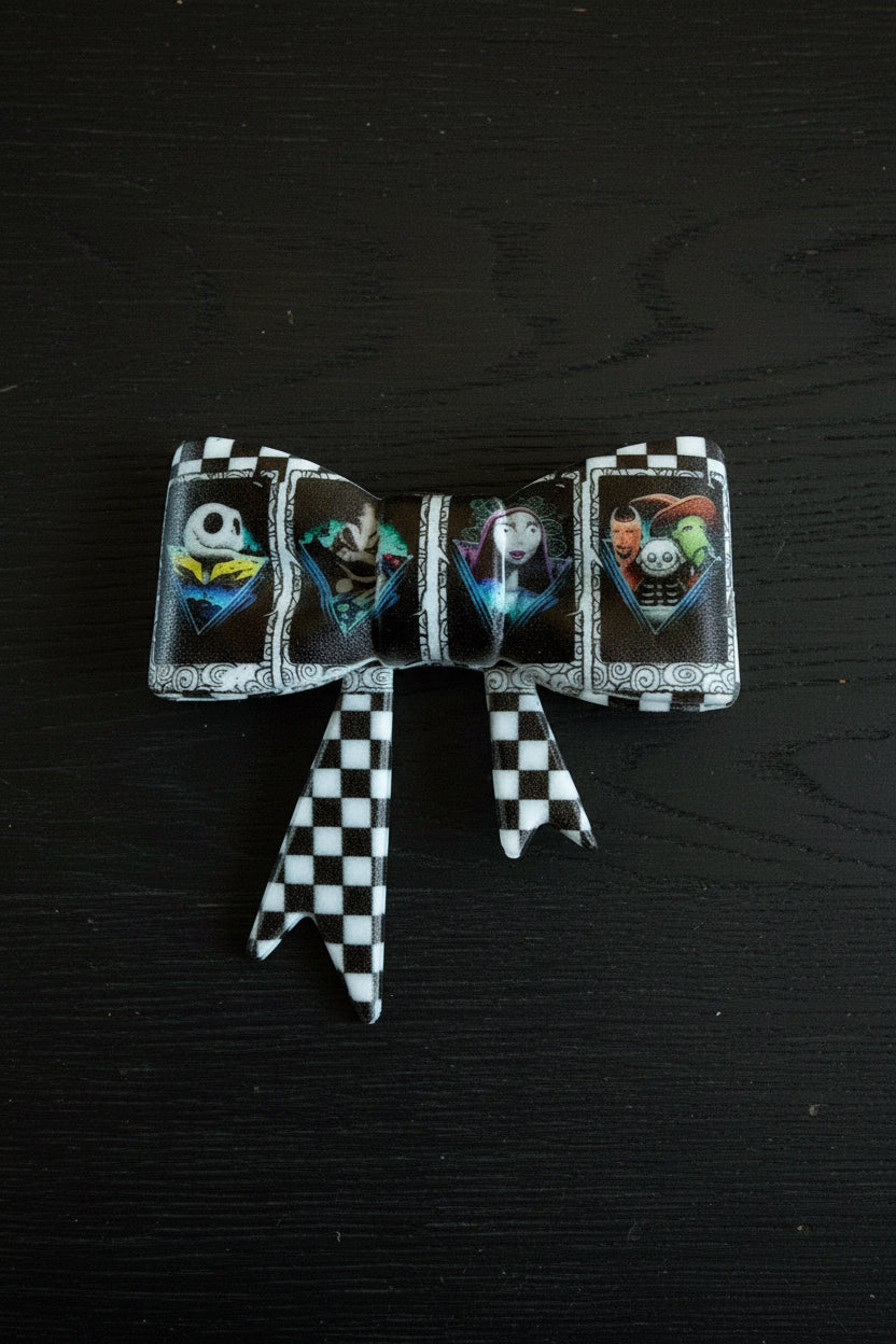 Horror silicone bow featuring Nightmare Before Christmas characters Jack Sally and Oogie Boogie checkered design - Kingyscrafts