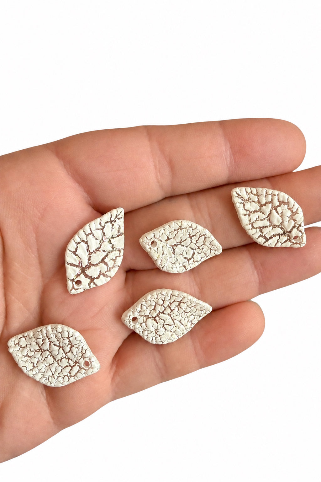 Pack of 25 pastel acrylic leaf beads.