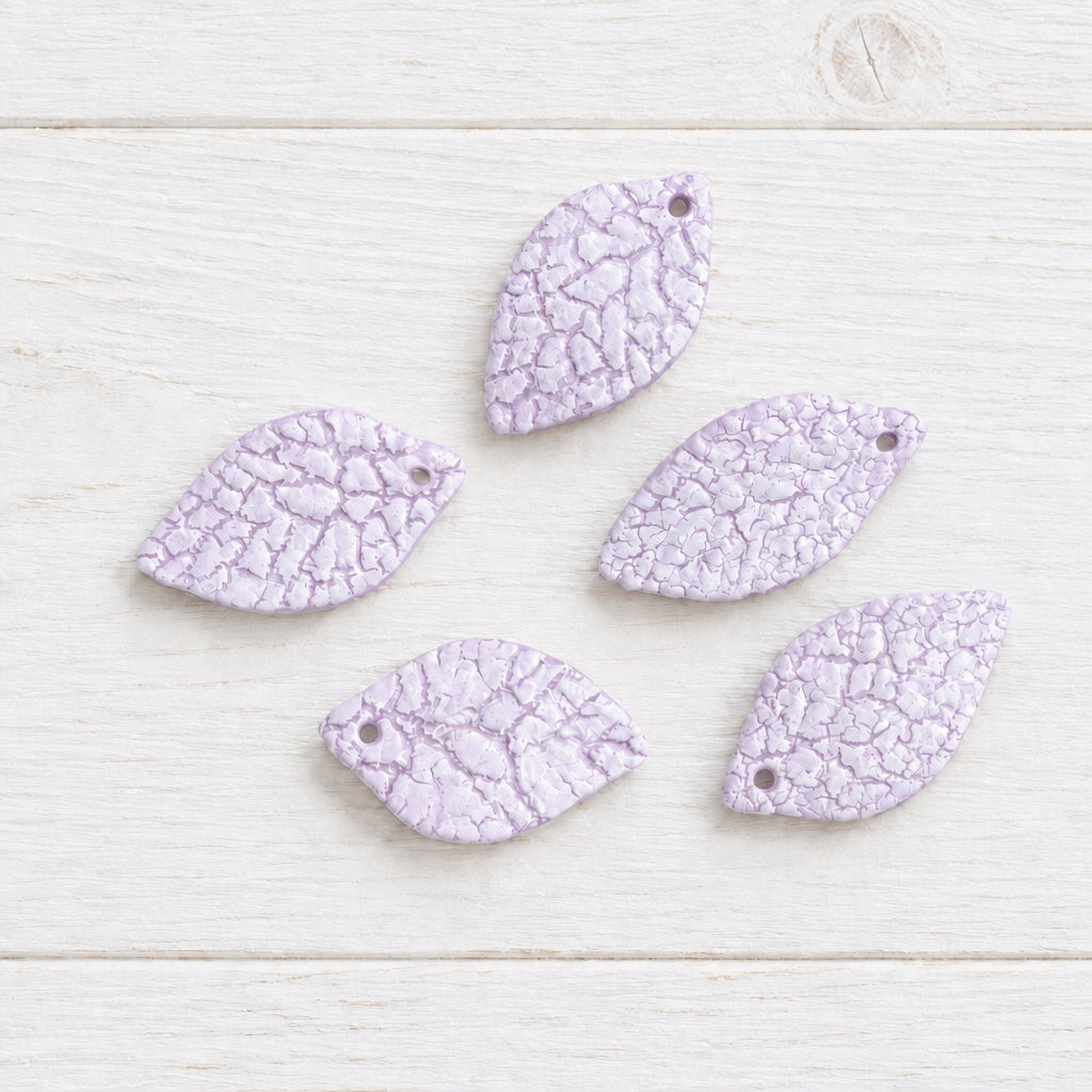 Pack of 25 pastel acrylic leaf beads.