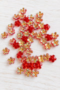 Five-petal glass sakura flower beads with an iridescent finish for jewellery-making and craft projects. ⠋