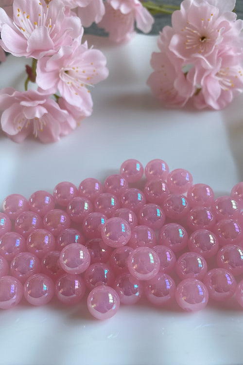 16mm pink shimmer beads pack of 5 for jewellery making displayed with cherry blossom - Kingyscrafts