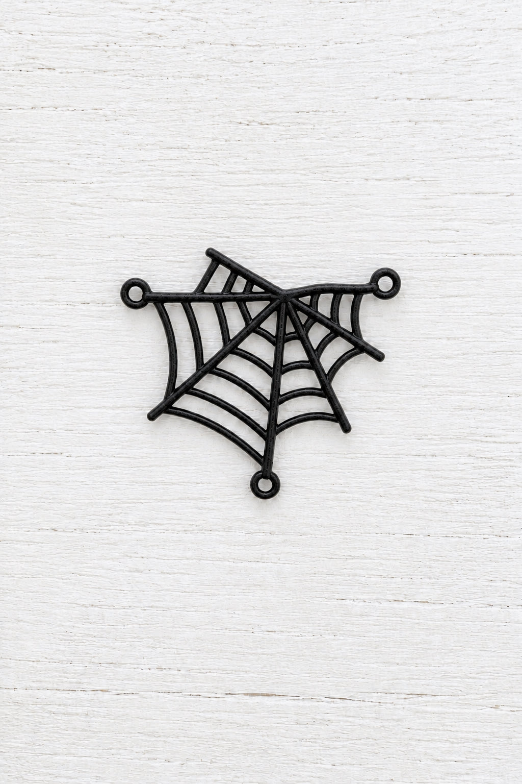 metal spider web connector with three attachment loops for jewellery making.