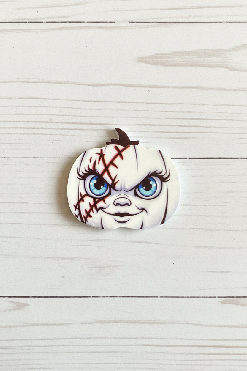 Halloween silicone focal bead in pumpkin shape with spooky face and stitch detail for pen making and crafts