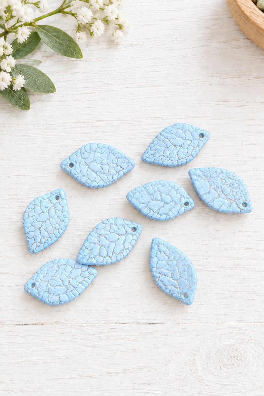 Pack of 25 pastel acrylic leaf beads.