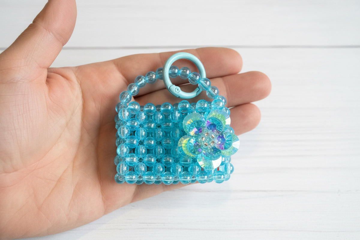 Handmade beaded bag charm with glass flower and keychain clasp