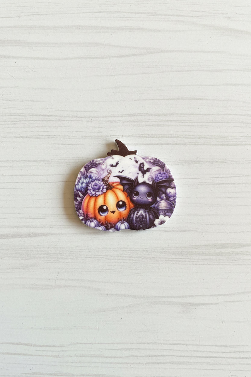 Halloween silicone focal bead in pumpkin shape with spooky face and stitch detail for pen making and crafts