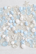 Mixed acrylic sea-themed beads in pale blue, white and clear, including shells, starfish, seahorses and turtles