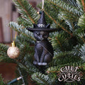 Purrah black cat hanging ornament wearing a pointed witch hat with silver skull and crescent moon details and a pentagram on its forehead.