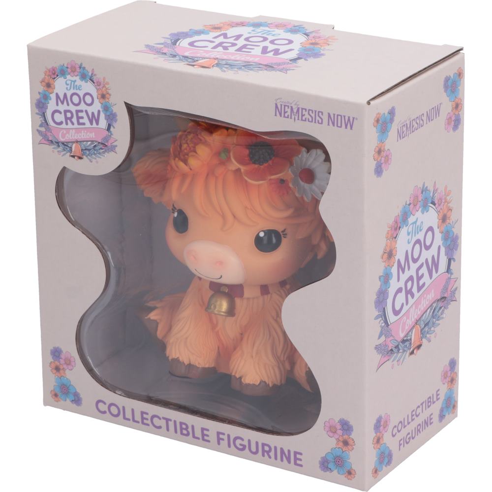 Moo Crew Marigold orange cow figurine with a flower crown and bell collar, displayed among autumn flowers.