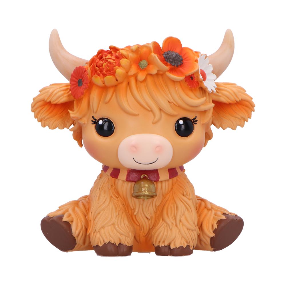 Moo Crew Marigold orange cow figurine with a flower crown and bell collar, displayed among autumn flowers.