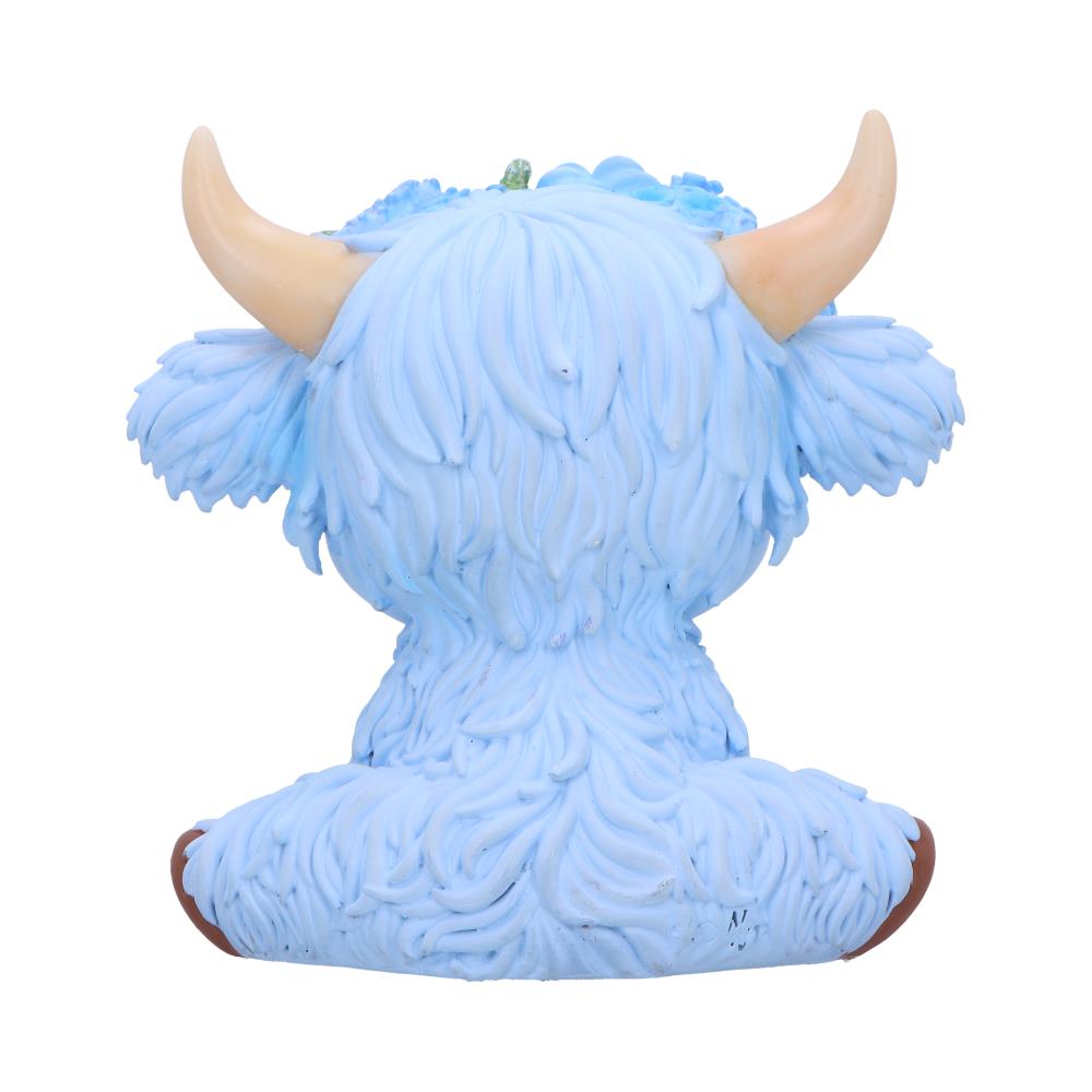 Moo Crew Bluebell blue cow figurine with a blue and white floral crown and gold bell, displayed among blue flowers
