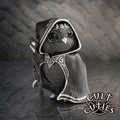 Featheros Cult Cuties black bird figurine wearing a silver-trimmed hooded cloak with a pentagram clasp and holding a magical staff.