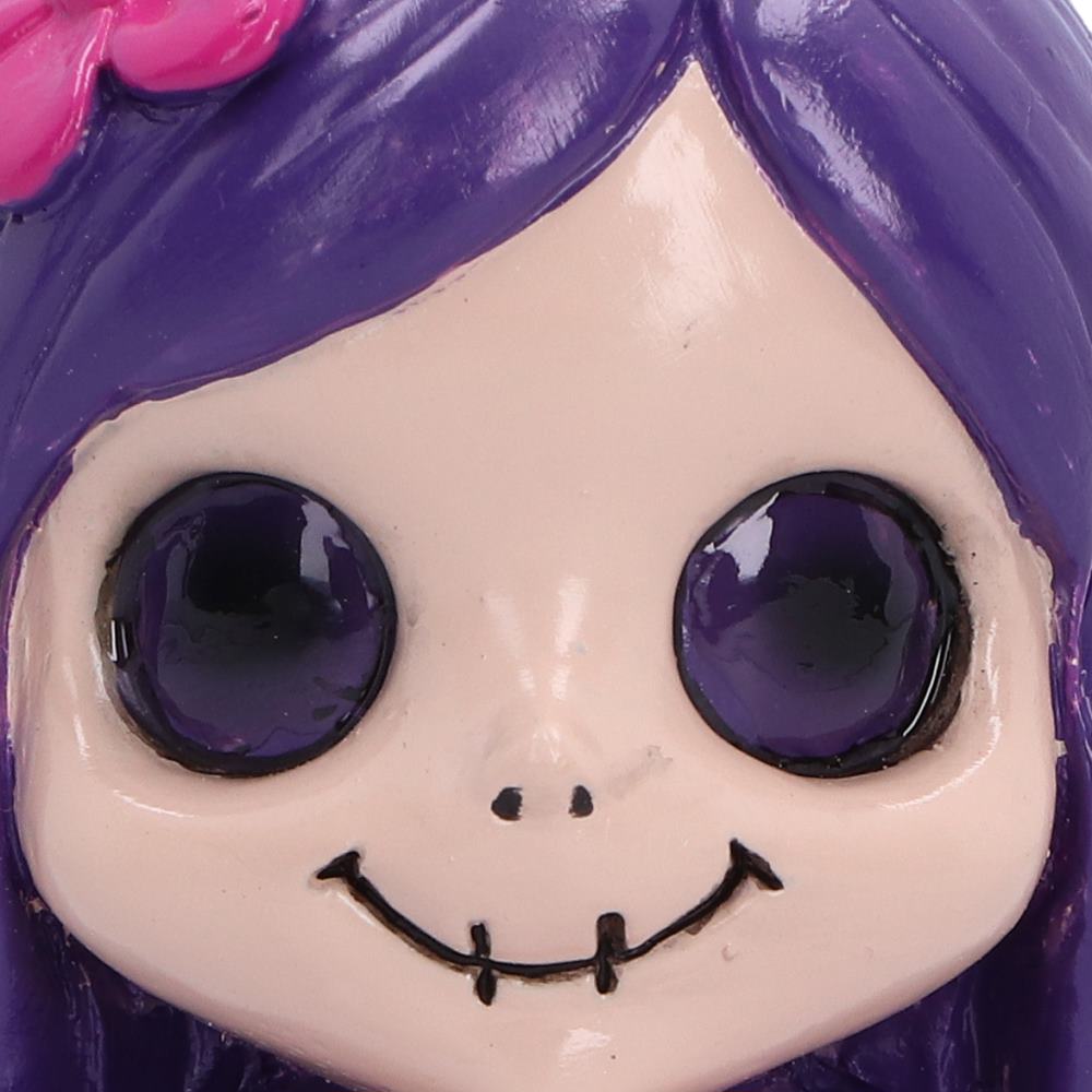 Spirit Fairy Mirella figurine with purple hair and dress, pink wings and large dark eyes, holding a melting red heart