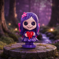 Spirit Fairy Mirella figurine with purple hair and dress, pink wings and large dark eyes, holding a melting red heart