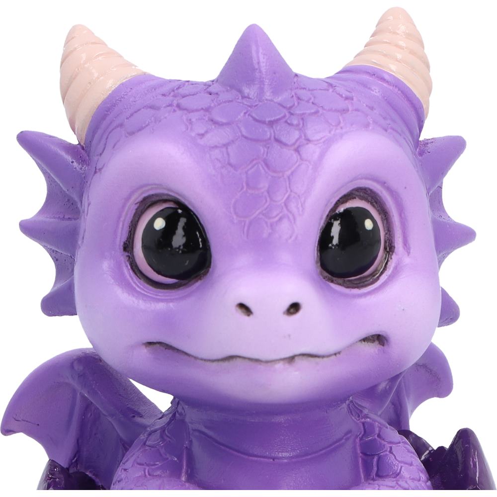 Shellbound purple baby dragon figurine with large black eyes, cream horns and tiny wings, emerging from a cracked purple egg.